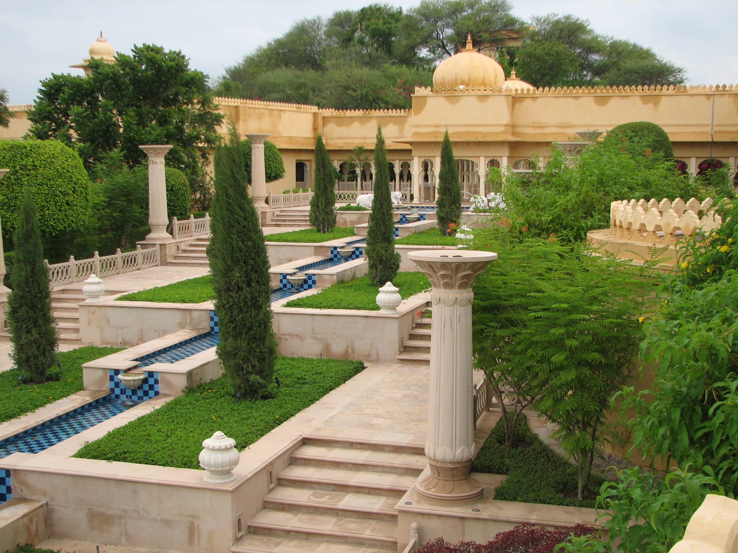 The inner courtyard garden of the central hotel, this was the walkway to and from our rooms from the lobby (they had a covered and slightly more direct route too for when it rained). It definitely felt luxurious to arrive out of your room in the morning at the top to the look down these tiered garden to breakfast. While in Udaipur I got the chance to stay at the fabulous and luxurious Udaivilas Resort. The Udaivilas is a new Oberoi 5-star property that is built to resemble a palace and does a good job of it. Sprawling and with a killer view, it is was really something else. I'm not used to such luxury, but appreciated its asctetics and incredible attention to detail. Unfortunately with the monsoon rains most of our time in Udaipur, I didn't get much shots that did it justice. But can't beat its location right on the Pichola Lake where we could see the City Palace, the Lake Palace Hotel and across the lake to hills beyond.