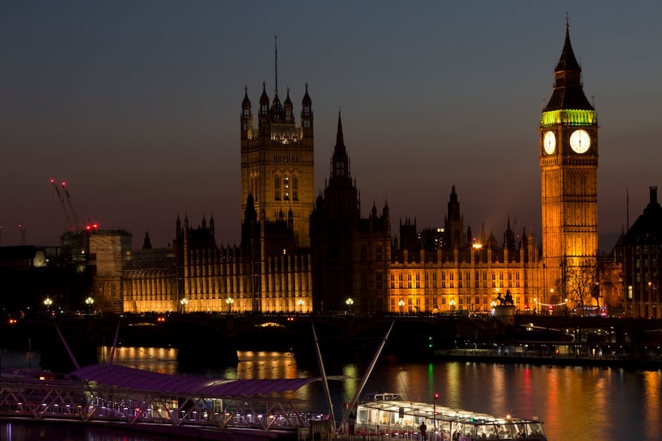 Illuminated Big Ben and Westminster Palace at twilight in London, England