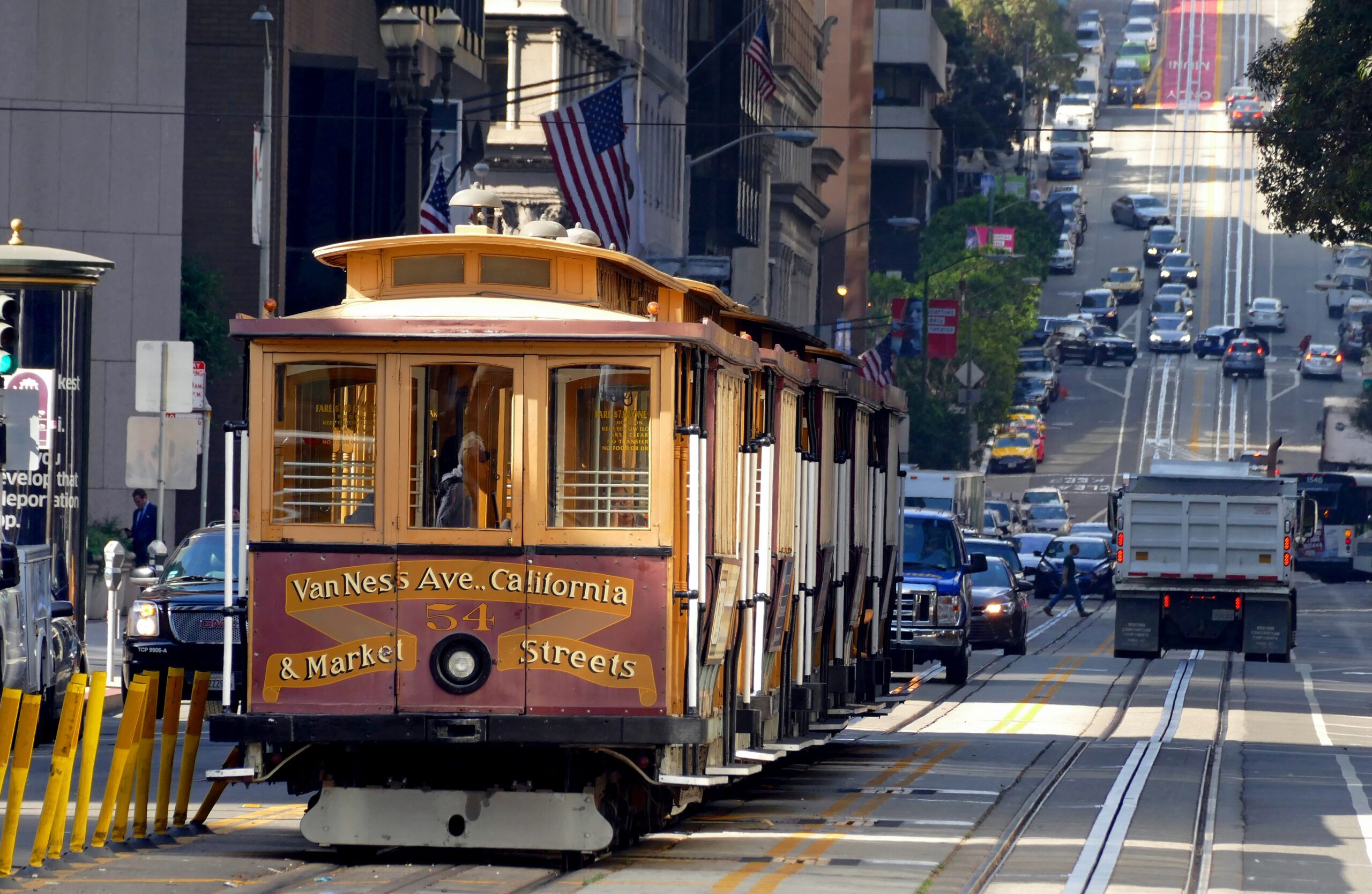 The San Francisco cable car system is the world's last manually operated cable car system. An icon of San Francisco, the cable car system forms part of the intermodal urban transport network operated by the San Francisco Municipal Railway. Of the 23 lines established between 1873 and 1890, only three remain (one of which combines parts of two earlier lines): two routes from downtown near Union Square to Fisherman's Wharf, and a third route along California Street. While the cable cars are used to a certain extent by commuters, the vast majority of their 7 million annual passengers are tourists. They are among the most significant tourist attractions in the city, along with Alcatraz Island, the Golden Gate Bridge, and Fisherman's Wharf. The cable cars are listed on the National Register of Historic Places. The cable cars are not to be confused with San Francisco's heritage streetcars, which operate on Market Street and the Embarcadero.